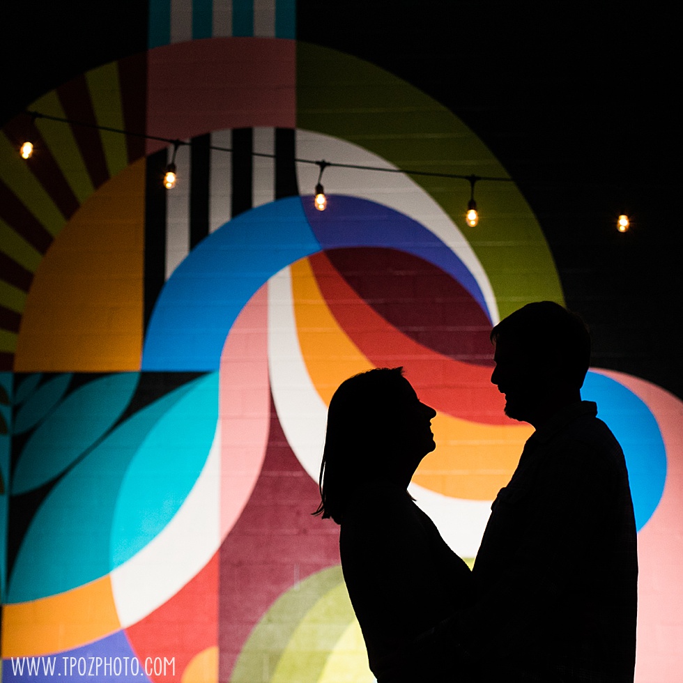 silhouette of a couple at Union Craft Brewery mural