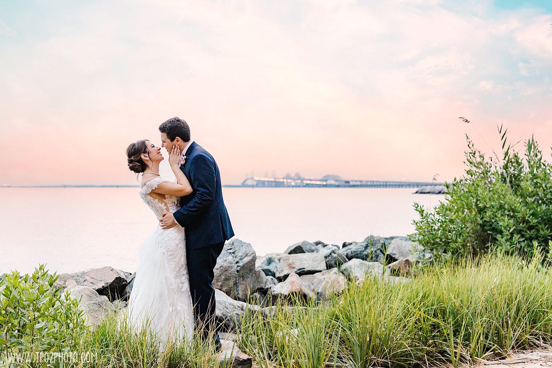 Bride and groom at sunset with the Chesapeake Bay Bridge in the background